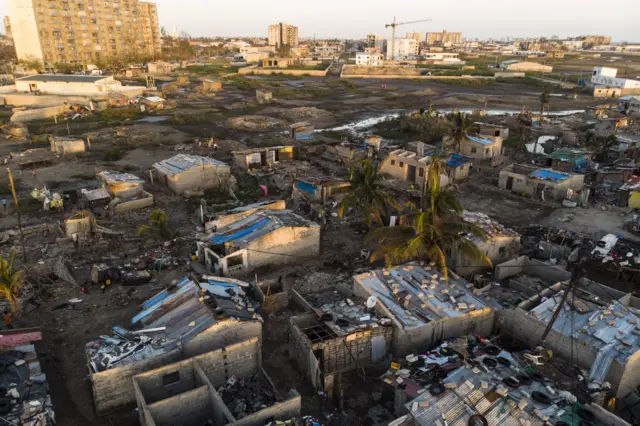 Debris and destroyed buildings which stood in the path of Cyclone Idai can be seen in this aerial photograph over the Praia Nova neighbourhood in Beira on April 1, 2019