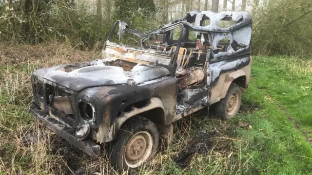 Burnt out Land Rover Defender