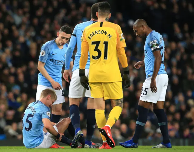 Oleksandr Zinchenko grabs his hamstring