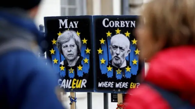 Theresa May and Jeremy Corbyn placards