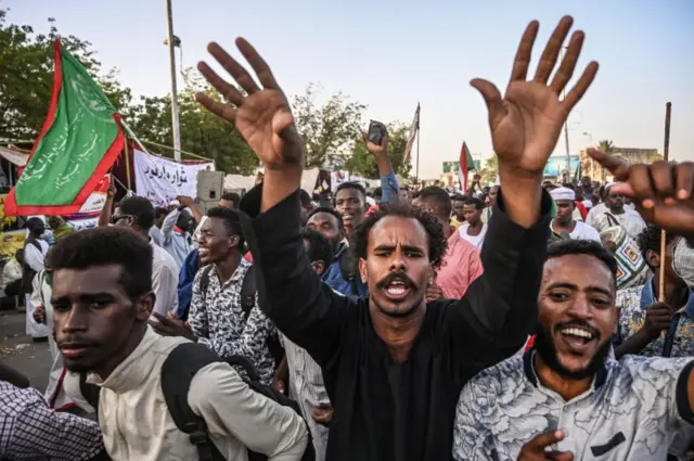 Sudanese protesters take part in a sit-in outside the army headquarters in the capital Khartoum on April 29, 2019