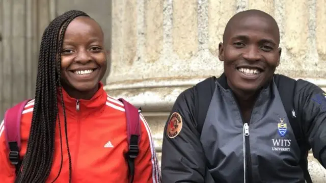 Kgomotso Malatjie (L) and Vuyo Ndata pictured sitting on the steps at a university campus