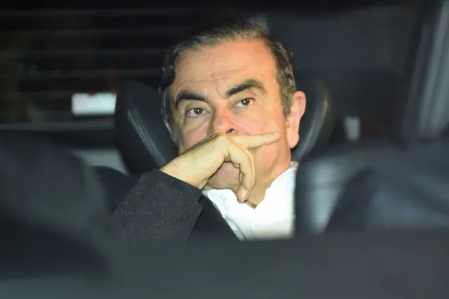 Former Nissan chairman Carlos Ghosn leaves his lawyers' offices after he was released earlier in the day from a detention centre after posting bail in Tokyo on March 6, 2019.