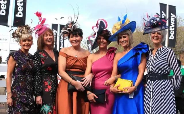 Racegoers during Ladies Day of the 2019 Randox Health Grand National Festival at Aintree Racecourse