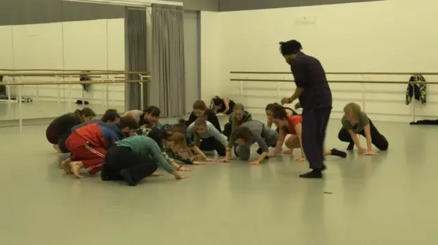 Miguel Altunaga and a group of dancers