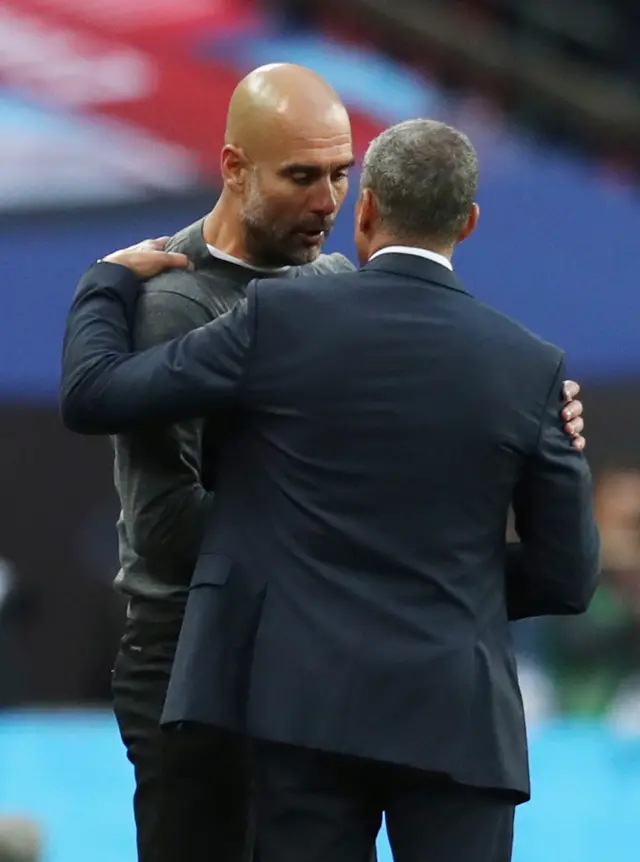 Pep Guardiola and Chris Hughton