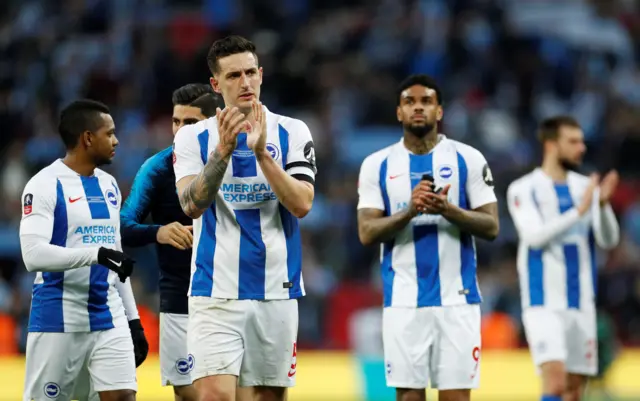 Brighton players applaud fans