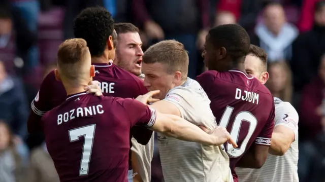 Hearts and Aberdeen players clash last weekend