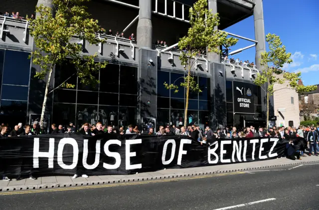 Newcastle fans outside St James' Park with banner 'House of Benitez'