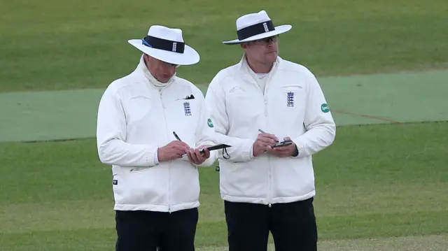 Umpires Neil Mallender and Martin Saggers