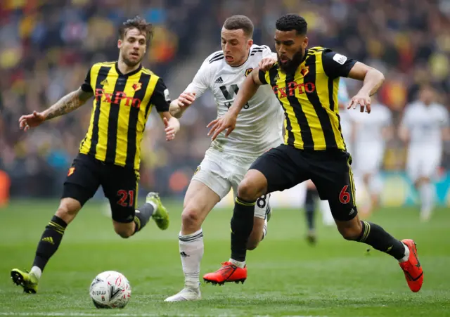 Diogo Jota in action with Watford"s Adrian Mariappa and Kiko Femenia