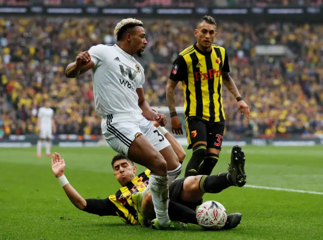 Watford"s Adam Masina and Roberto Pereyra in action with Wolverhampton Wanderers' Adama Traore