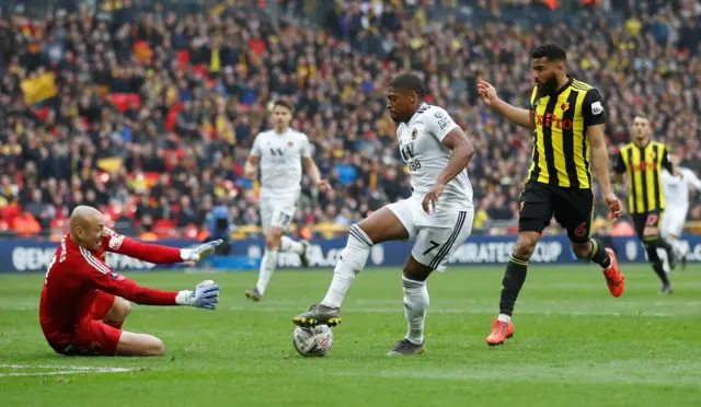 Ivan Cavaleiro in action with Watford's Heurelho Gomes and Adrian Mariappa