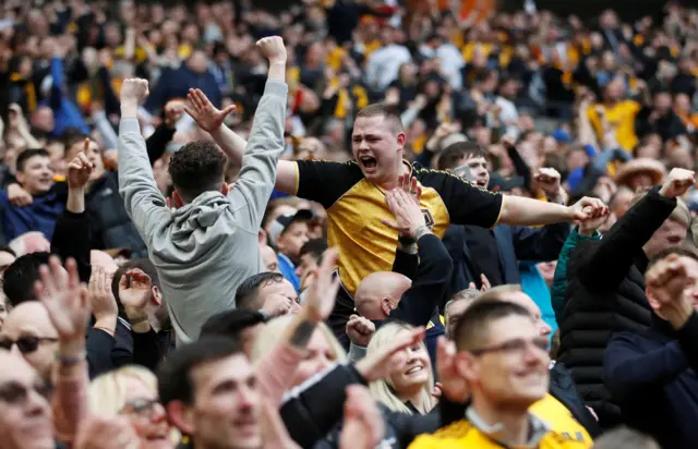 Wolverhampton Wanderers fans celebrate their first goal scored by Wolverhampton Wanderers" Matt Doherty