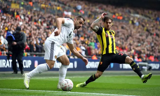 Jonny Castro (left) and Watford's Kiko Femenia battle for the ball during the FA Cup semi final match at Wembley Stadium