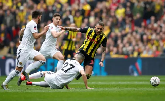 Watford's Roberto Pereyra in action with Wolverhampton Wanderers' Romain Saiss