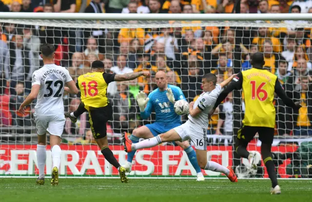 Connor Coady blocks a goalbound Andre Gray shot