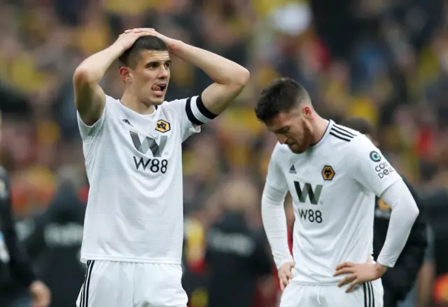 Wolverhampton Wanderers' Conor Coady and Matt Doherty react after the match