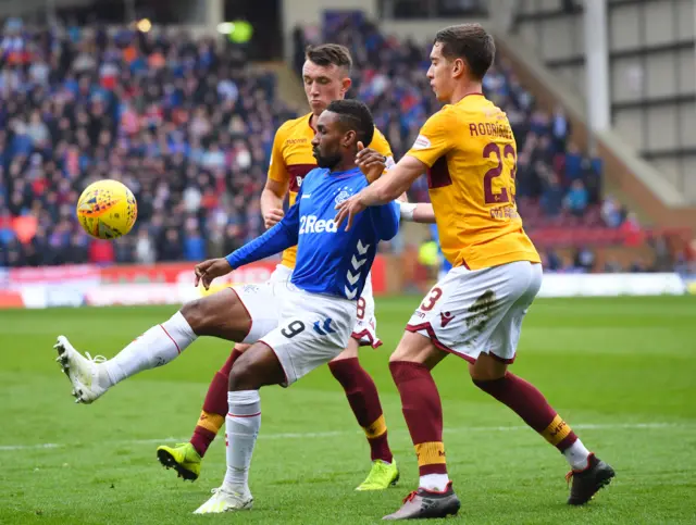 Jermain Defoe holds off two Motherwell players