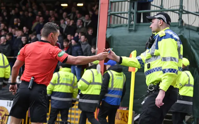 Referee Nick Walsh hands