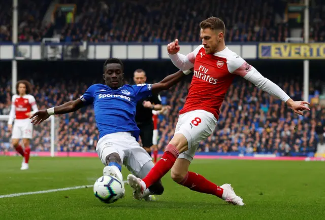 Arsenal"s Aaron Ramsey in action with Everton"s Idrissa Gueye