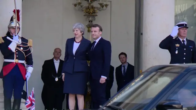 President Macron greets Theresa May in Paris