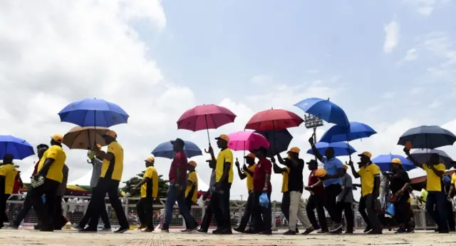 People holding umbrellas