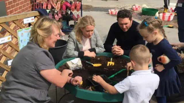 Lucy Beaumont and Jon Richardson with some children