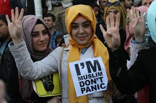 Supporters of Egyptian Muslim Brotherhood take part in a rally to protest against the death penalties for  members of the group in Egypt, outside the Egyptian embassy in Ankara on 9 April 2014