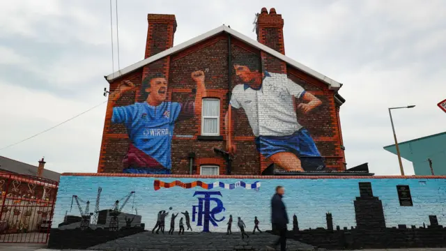A mural on the side of a house near Prenton Park before the start of the match