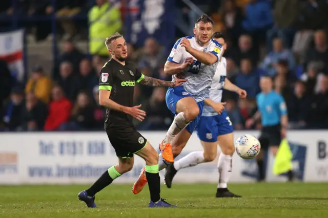 Tranmere Rovers' Liam Ridehalgh (right) and Forest Green Rovers' Carl Winchester