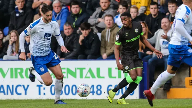Forest Green Rovers Reece Brown passes the ball forward