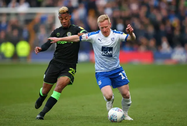 David Perkins of Tranmere Rovers holds off a challenge from Junior Mondal of Forest Green
