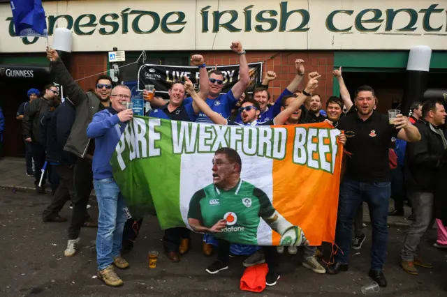 Fans with a flag with a picture of Tadhg Furlong and the words 'Pure Wexford Beef'