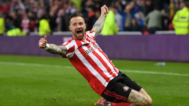 Chris Maguire celebrates