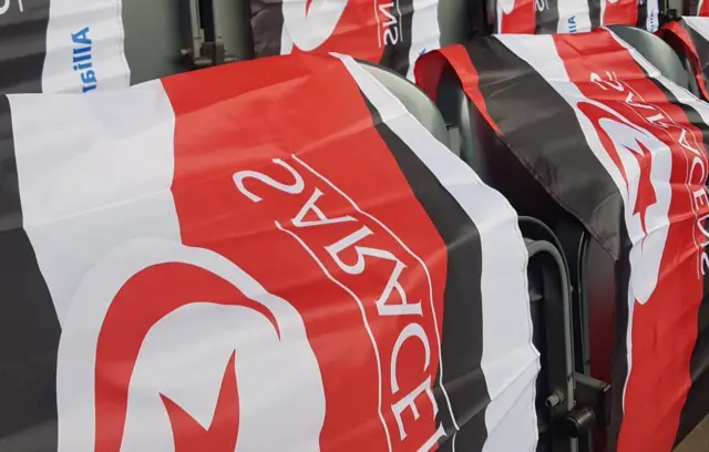 Saracens flags on chairs in the stadium