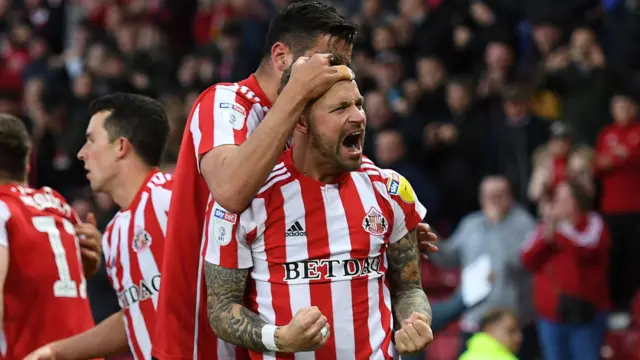 Chris Maguire celebrates