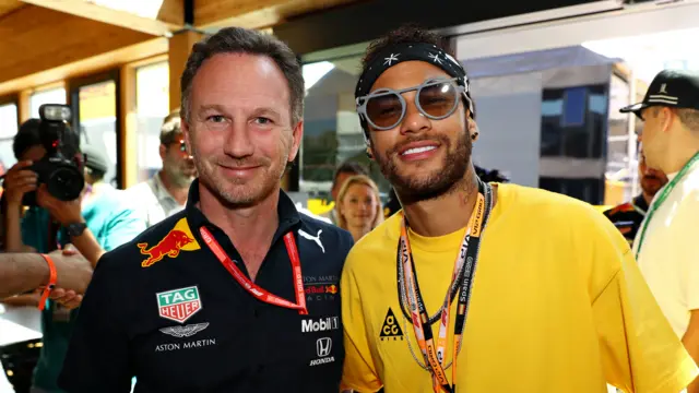 Brazilian football superstar Neymar poses for a photo with Red Bull Racing Team Principal Christian Horner