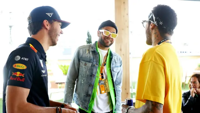 Brazilian football superstars Neymar and Dani Alves with driver Pierre Gasly