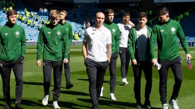 Captain Scott Brown leads the Celtic players out at Ibrox Stadium