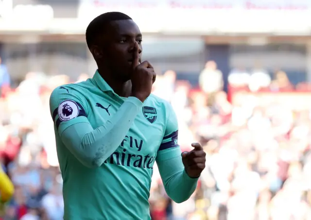 Eddie Nketiah celebrates by putting his finger to his lips to 'shush' the crowd