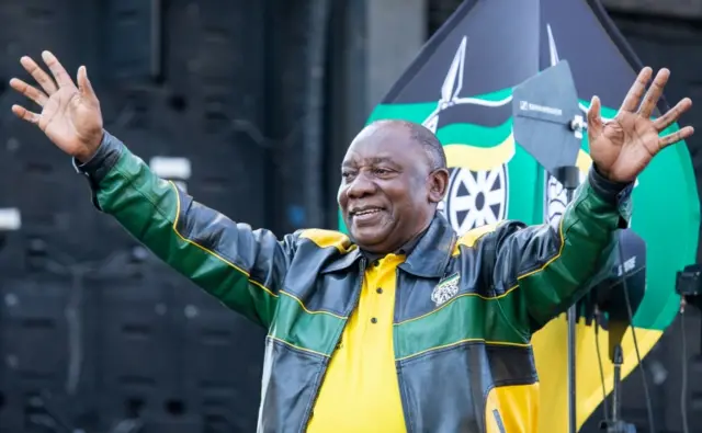 Cyril Ramaphosa greets the crowd after delivering a speech outside Lithuli House, the ANC's headquarters in Johannesburg, on May 12, 2019