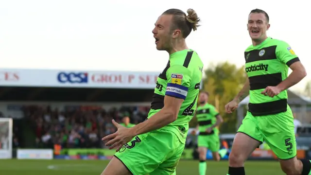 Joseph Mills celebrates