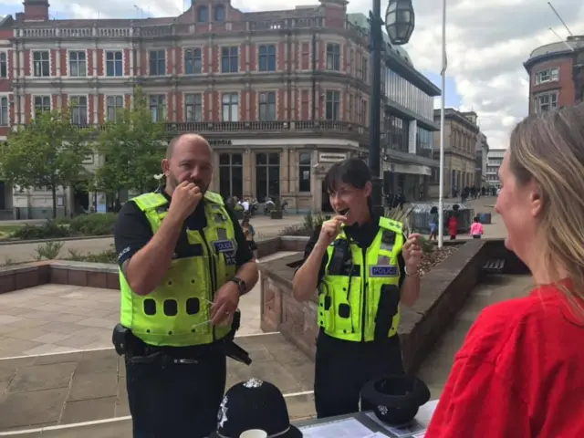 Police officers being swabbed