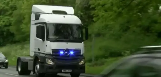 A lorry with blue light