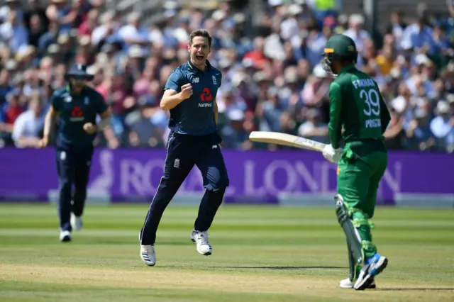 Chris Woakes of England celebrates taking the wicket of Fakhar Zaman of Pakistan