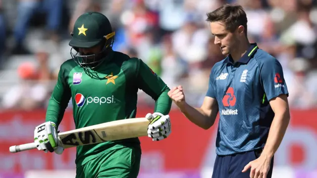 Chris Woakes of England celebrates dismissing Asif Ali of Pakistan