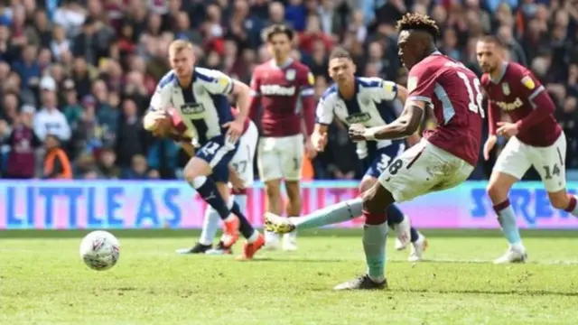 Tammy Abraham scores a penalty for Aston Villa