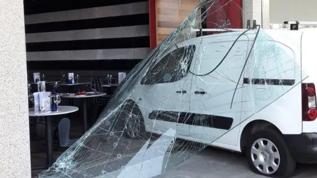 Van after crashing into restaurant