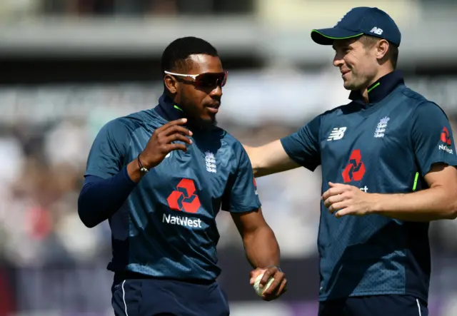 England fielder Chris Jordan is congratulated by Chris Woakes